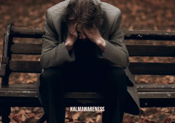 self compassion for men _ Image: A man sitting alone on a park bench, head in hands, looking defeated.Image description: A middle-aged man wearing a suit, hunched over on a weathered park bench, surrounded by autumn leaves. His face shows signs of distress.