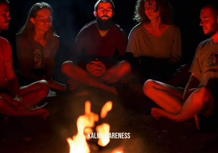 sit around the fire meditation _ Image: The same group has shifted their positions, sitting more comfortably with their legs crossed. The fire