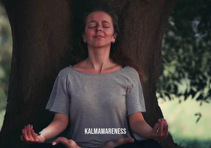 summ meditation _ Image: The same woman is now sitting with crossed legs under a tree, eyes closed, hands resting on her knees, engaged in meditation.Image description: The woman has found respite beneath the shade of a tree. Her posture has transformed—cross-legged, eyes closed, hands resting peacefully on her knees—as she immerses herself in a moment of meditation.