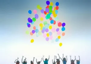 breath of joy _ Image: Children releasing colorful balloons into a clear sky, signifying hope and a cleaner environment. Image description: As a testament to their efforts, a group of children stands on the same patch of grass, releasing vibrant balloons into a sky that is now clear and blue. The balloons rise gracefully, carrying messages of hope and renewal. The transformation from polluted haze to clear skies illustrates a journey from adversity to triumph, where mindfulness and collective action have made a positive impact.