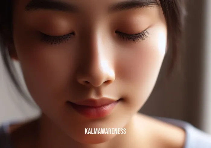 wave room yoga _ Image: Close-up of a participant's peaceful face in a meditative pose. Image description: Tranquility and mindfulness achieved through the practice.