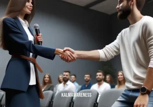 fully ready to listen _ Image: A handshake between the presenter and an audience member, signifying a successful resolution of the issue.Image description: A handshake between the presenter and an audience member, symbolizing a successful resolution and understanding.
